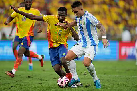 2026 FIFA World Cup Qualifying, Colombia vs Argentina: Argentina's Lautaro Martinez, right, and Colombia's Yerson Mosquera battle for the ball